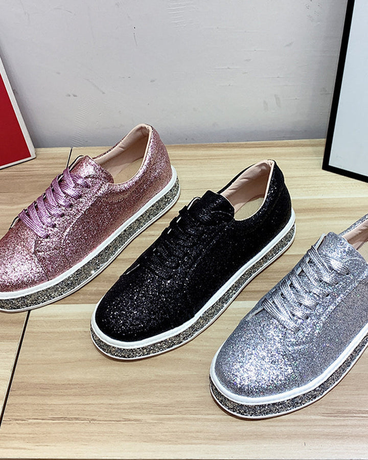 Close-up of women's sparkling glitter platform sneakers, designed for style, comfort, and versatile wear.