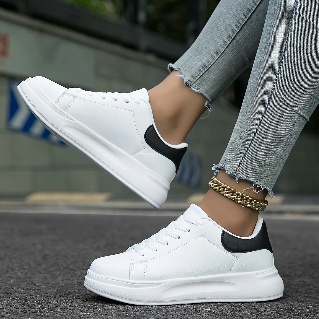 Comfortable women's platform trainers with a thick elevated sole and classic lace-up design, ideal for daily wear.