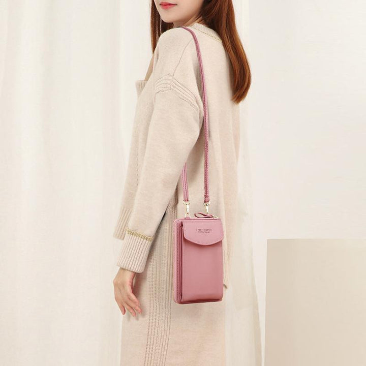 Portable PU leather phonebag for women, featuring a secure zip closure, side view