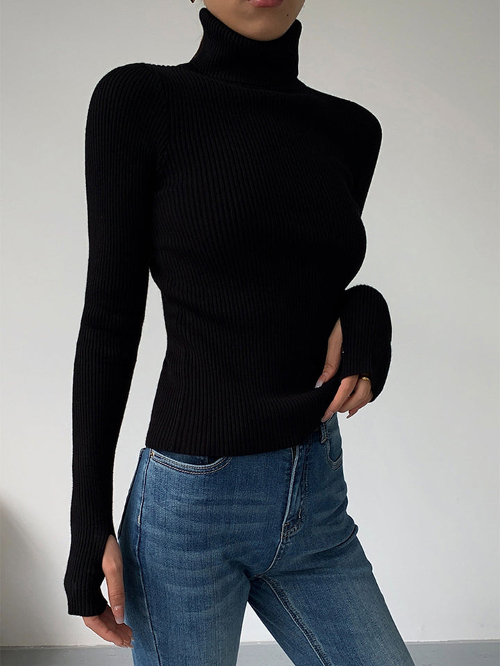 Front view of a white women's ribbed turtleneck, a classic and sophisticated knit top.
