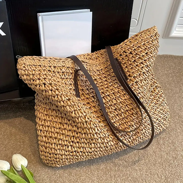 Spacious women's straw tote bag, large enough for all beach essentials and summer trips.
