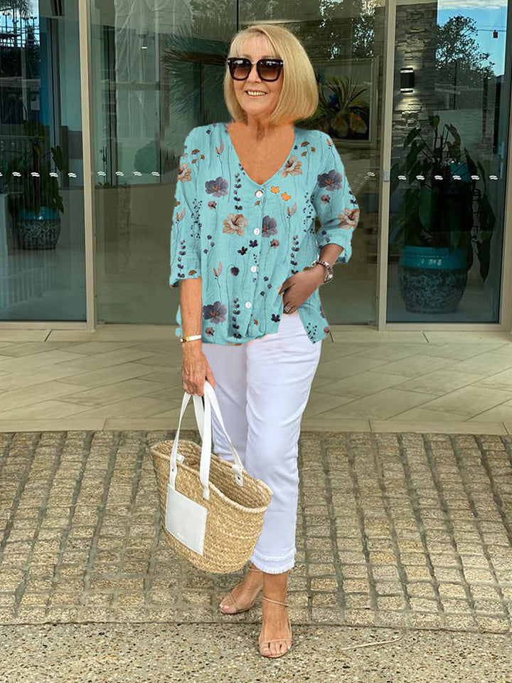 Women's stylish three-quarter sleeve V-neck blouse, perfect for casual elegant spring & summer fashion.