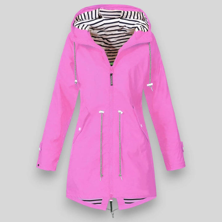 Fashionable women's hooded rain jacket. Lightweight, waterproof, and durable for versatile casual wear.