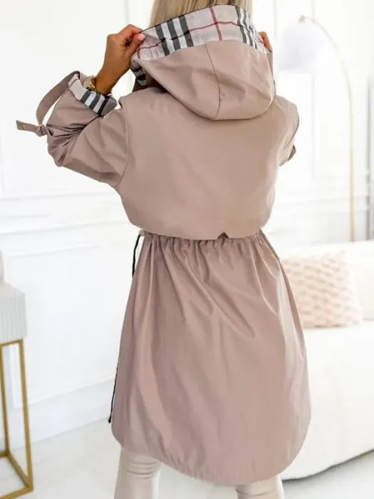 Fashionable women's all-weather waterproof zip coat. A hooded, windproof jacket for chic fall & winter protection.