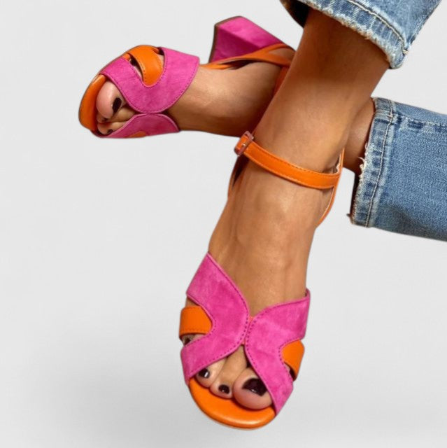 Pink women's supportive wedge heel sandals with adjustable strap for ultimate comfort & chic summer style.