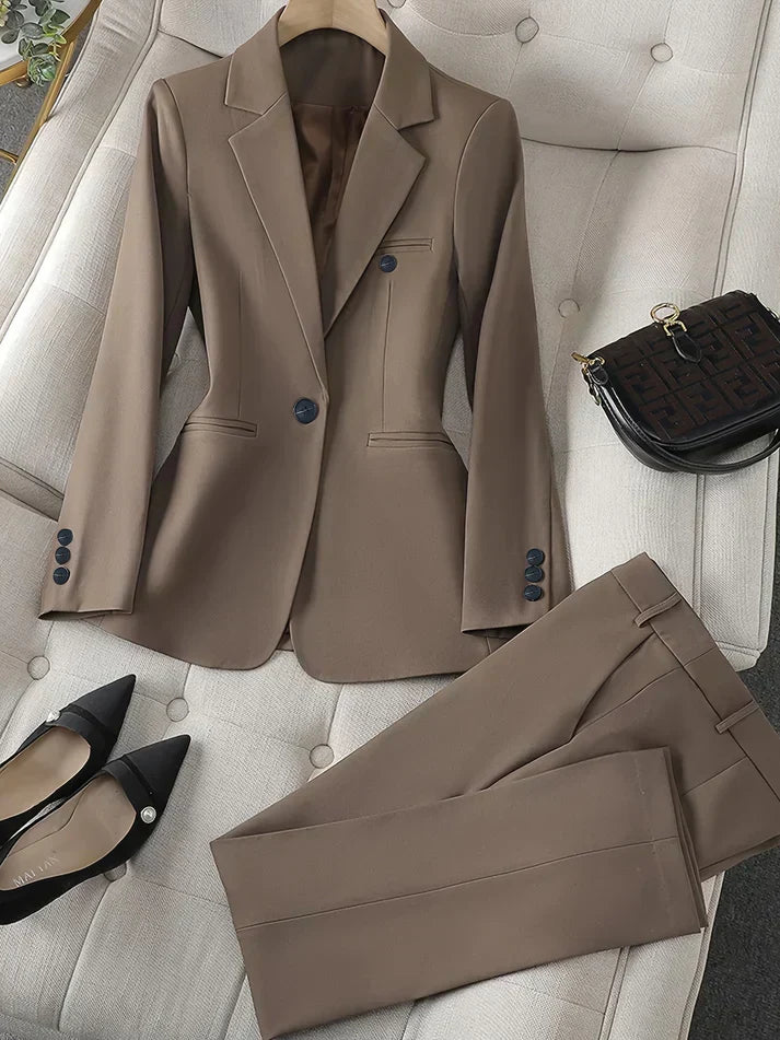 Chic women's two-piece suit with a notched lapel blazer & tailored trousers, ideal for formal wear.