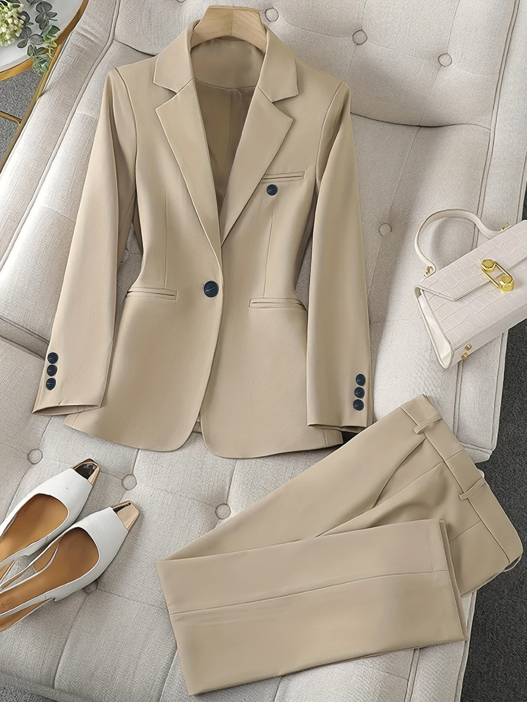 Stylish women's notched lapel blazer, part of a tailored suit, suitable for office & business events.