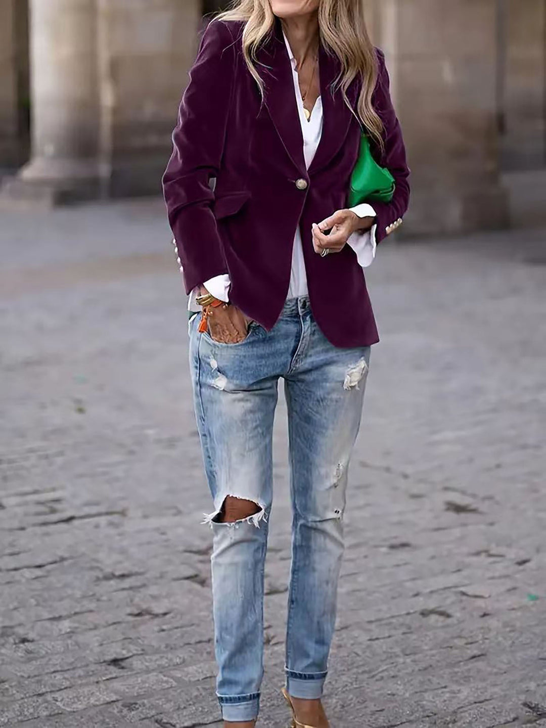 Elegant women's long-sleeve velvet blazer with shiny gold buttons, perfect for adding a touch of class.