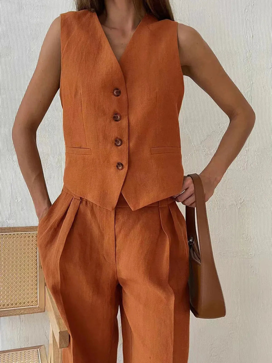Women's 2-piece tailored set: chic waistcoat & wide-leg trousers for an elegant summer fashion statement.