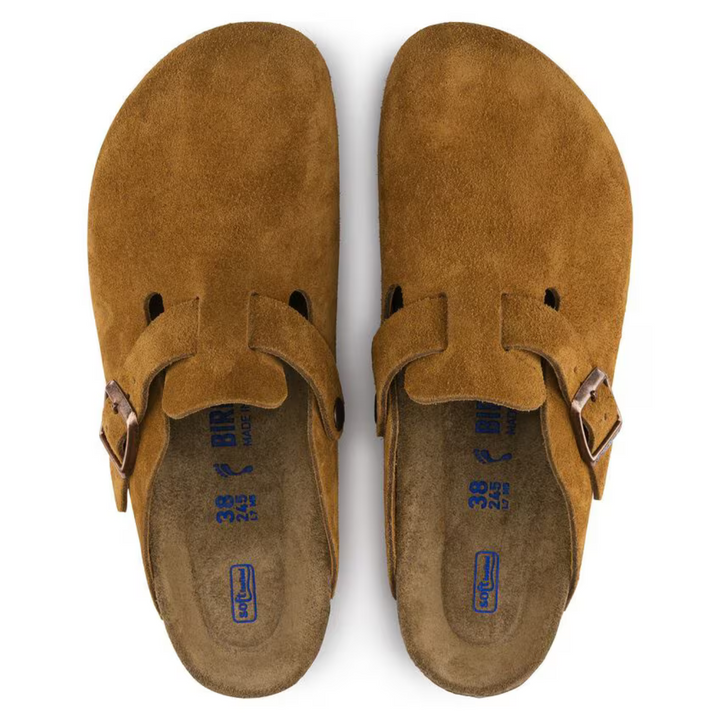 Stylish taupe slip-on clogs for women, offering easy wear and all-day comfort with a supportive footbed.