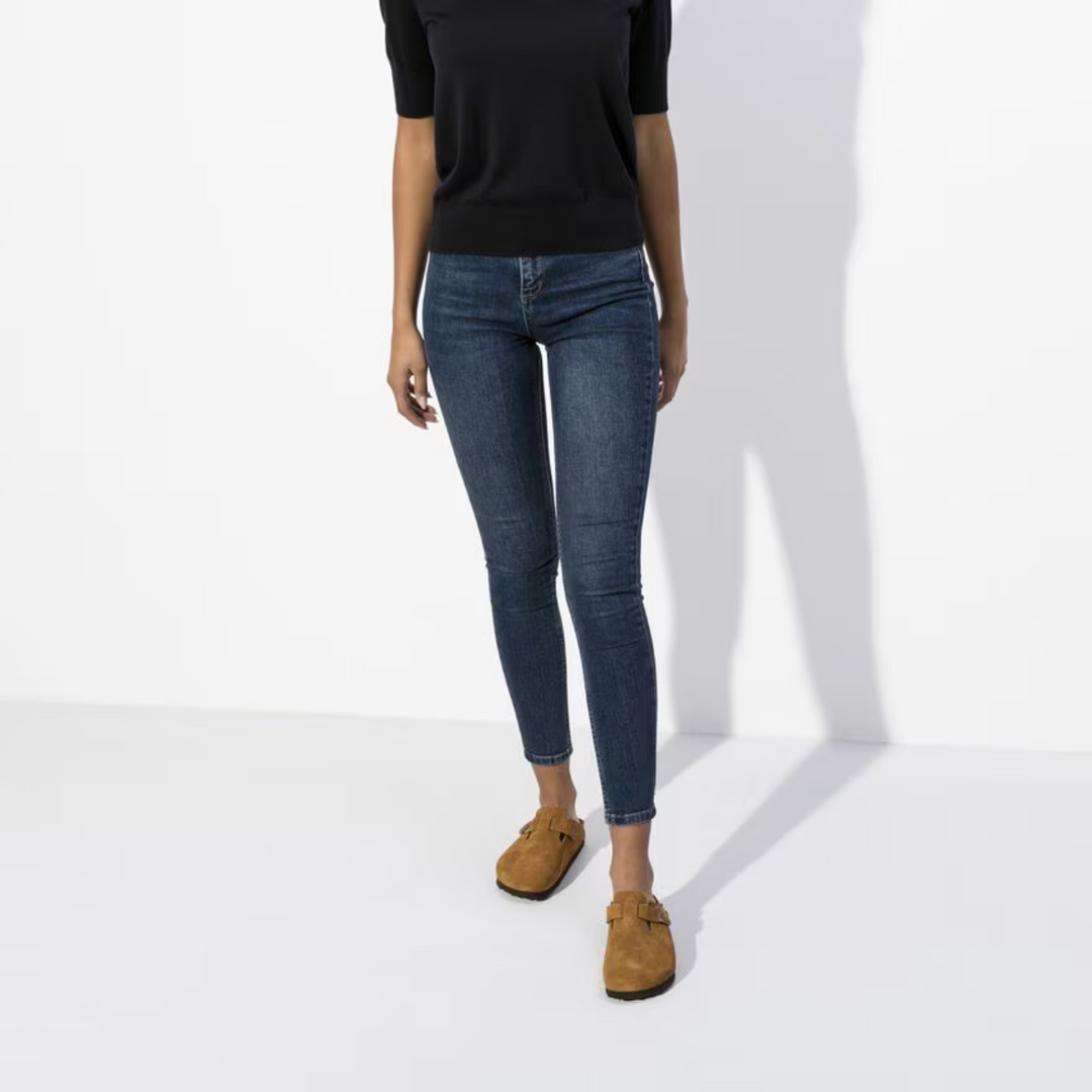 Taupe women's clogs with a premium cushioned footbed and adjustable strap, perfect for casual outings.