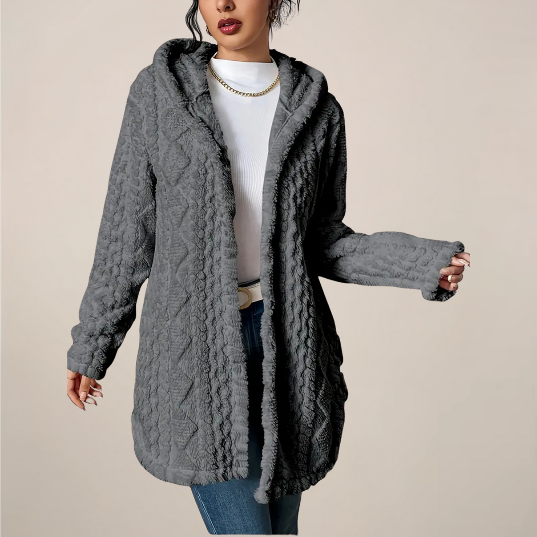 Women's textured knit longline hooded cardigan in a soft neutral color, perfect for spring layering.