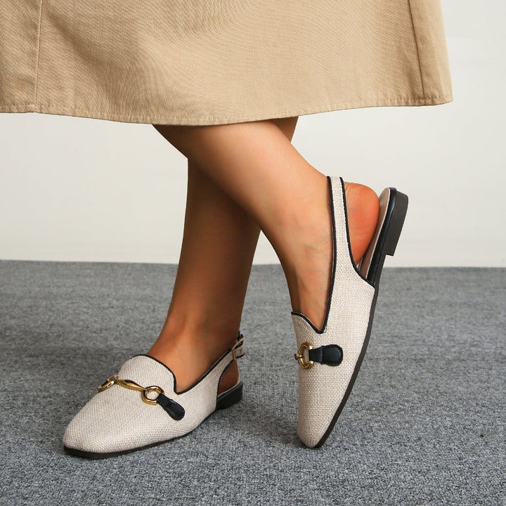 Elegant women's textured slingback loafer flats, offering a sophisticated touch to outfits.