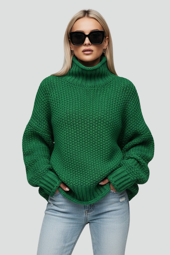 Textured knit detail of a women's long sleeve turtleneck sweater; comfortable winter fashion.