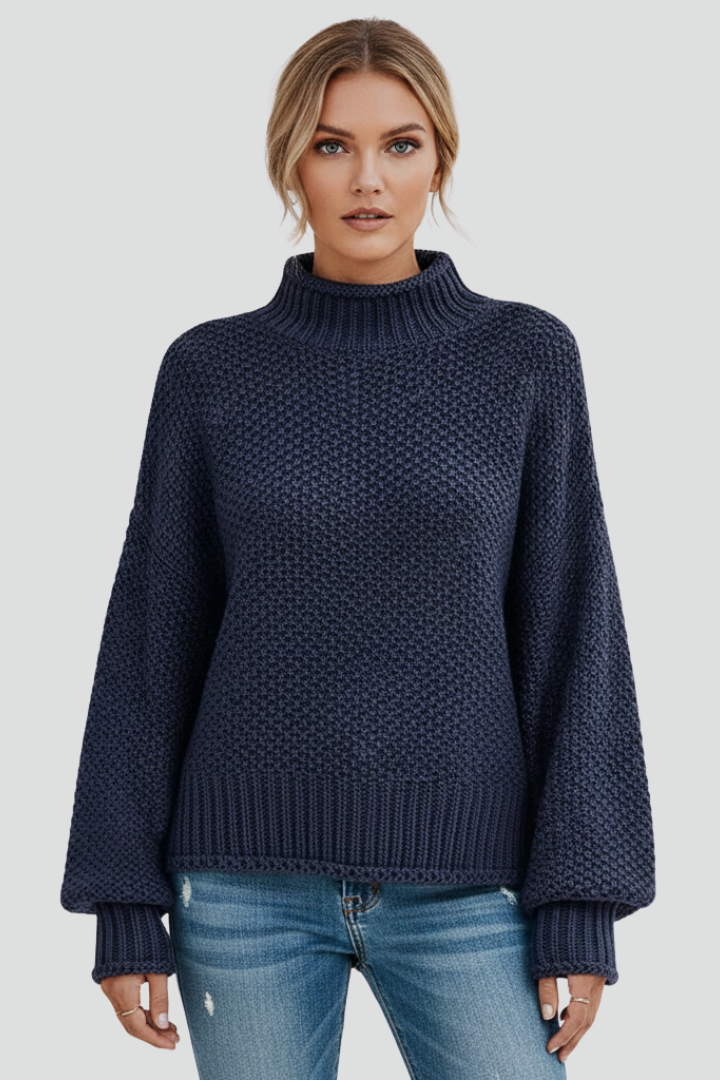 Back detail of a women's textured knit turtleneck jumper; comfortable winter casual wear.