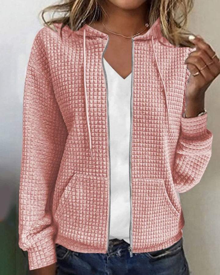 Relaxed fit women's textured zip-up hoodie jacket with a functional hood, ideal for casual layering & comfort.