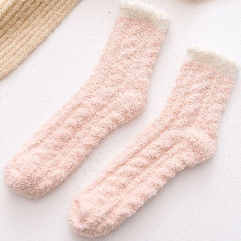 Folded stack of colorful women's fleece-lined thermal winter socks, great as a gift.