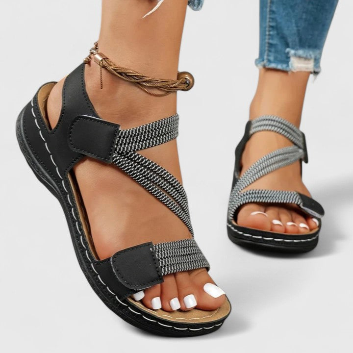 Orthopedic women's sandals with triple arch support, designed for plantar fasciitis relief & comfort.
