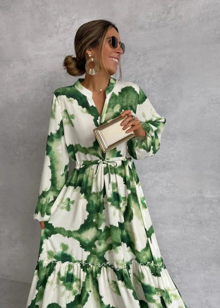 Flowy women's tie-dye long sleeve tiered maxi dress in green. Features a stylish belt for a bohemian look.