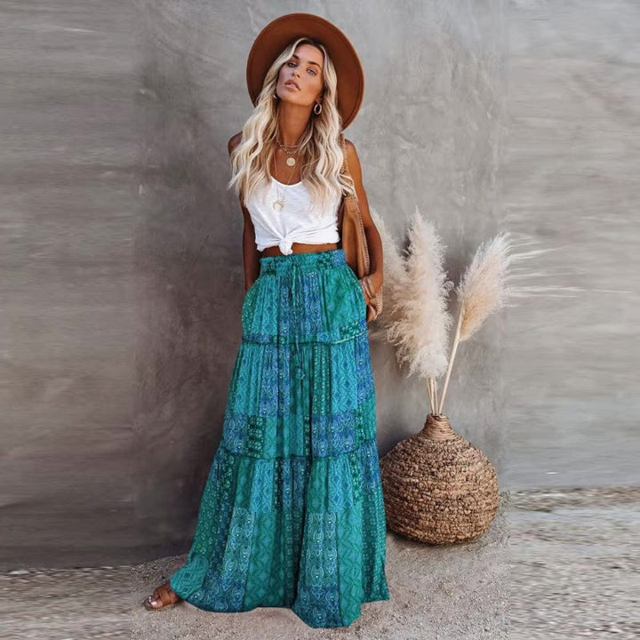 Women's floral print tiered maxi skirt with high elastic waist for a comfortable, stylish summer look.