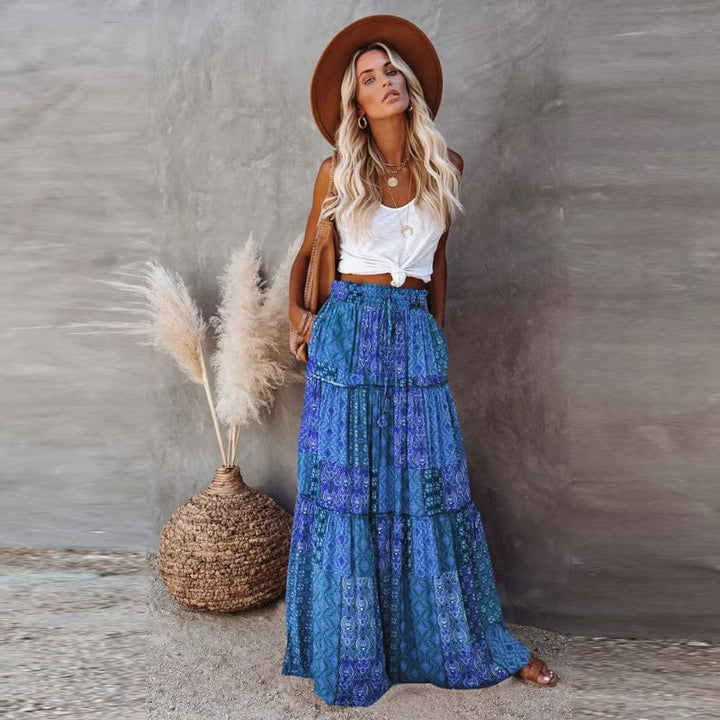 Comfortable women's tiered maxi skirt, elastic waist. Versatile floral print skirt for casual, vacation, beach.