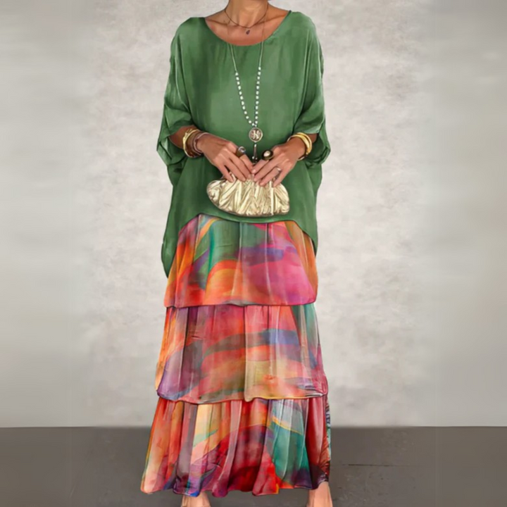 Women's tiered maxi dress with long sleeves in a vibrant floral print, perfect for casual everyday wear.