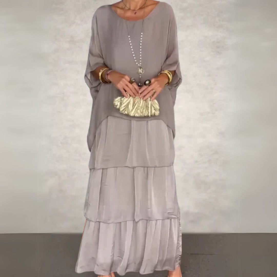 Plus size women's tiered maxi dress, long sleeve, showcasing a beautiful pattern & comfortable flowy design.