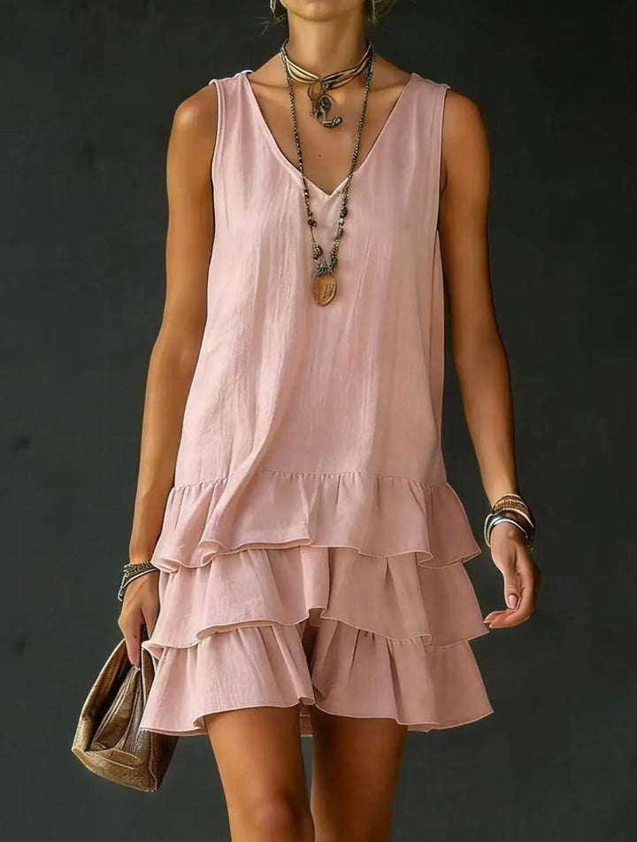 Women's tiered ruffle mini dress, sleeveless V-neck. Perfect for summer, vacation, or beach casual wear.