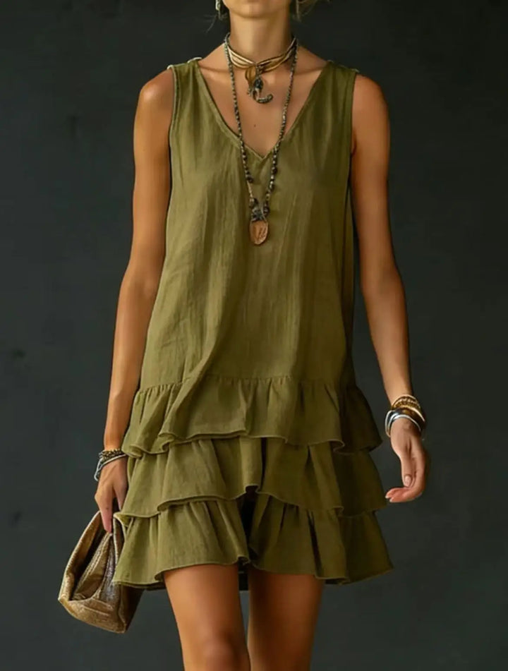 Sleeveless V-neck mini dress with elegant tiered ruffles. A chic & casual women's summer day dress.