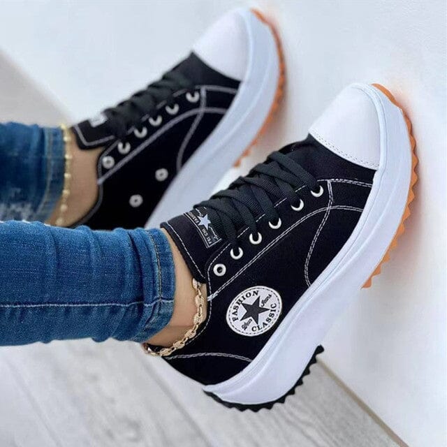 Comfortable low-top women's sneakers featuring a thick chunky sole, blending trendy design with everyday wear.
