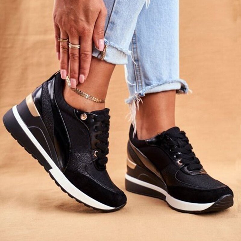Pair of women's trendy gold and black non-slip sneakers, ideal for walking and casual outfits