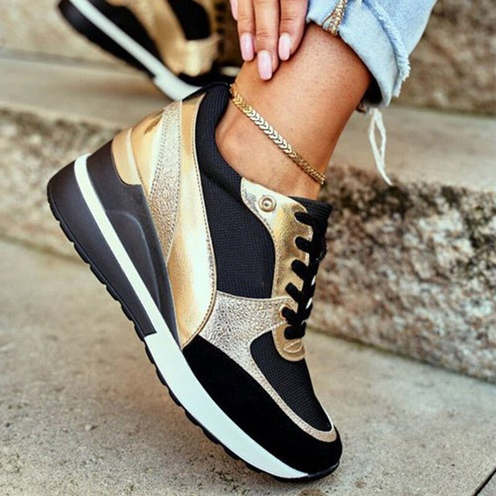Stylish women's gold & black non-slip sneakers, offering comfort and an athletic fashion look