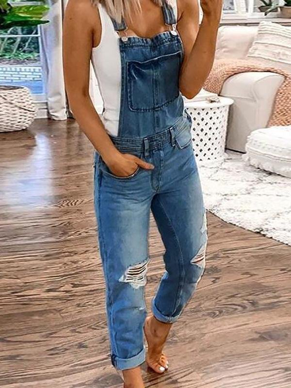 Casual denim overalls for women featuring trendy rips. A versatile fashion jumpsuit for spring & summer style.