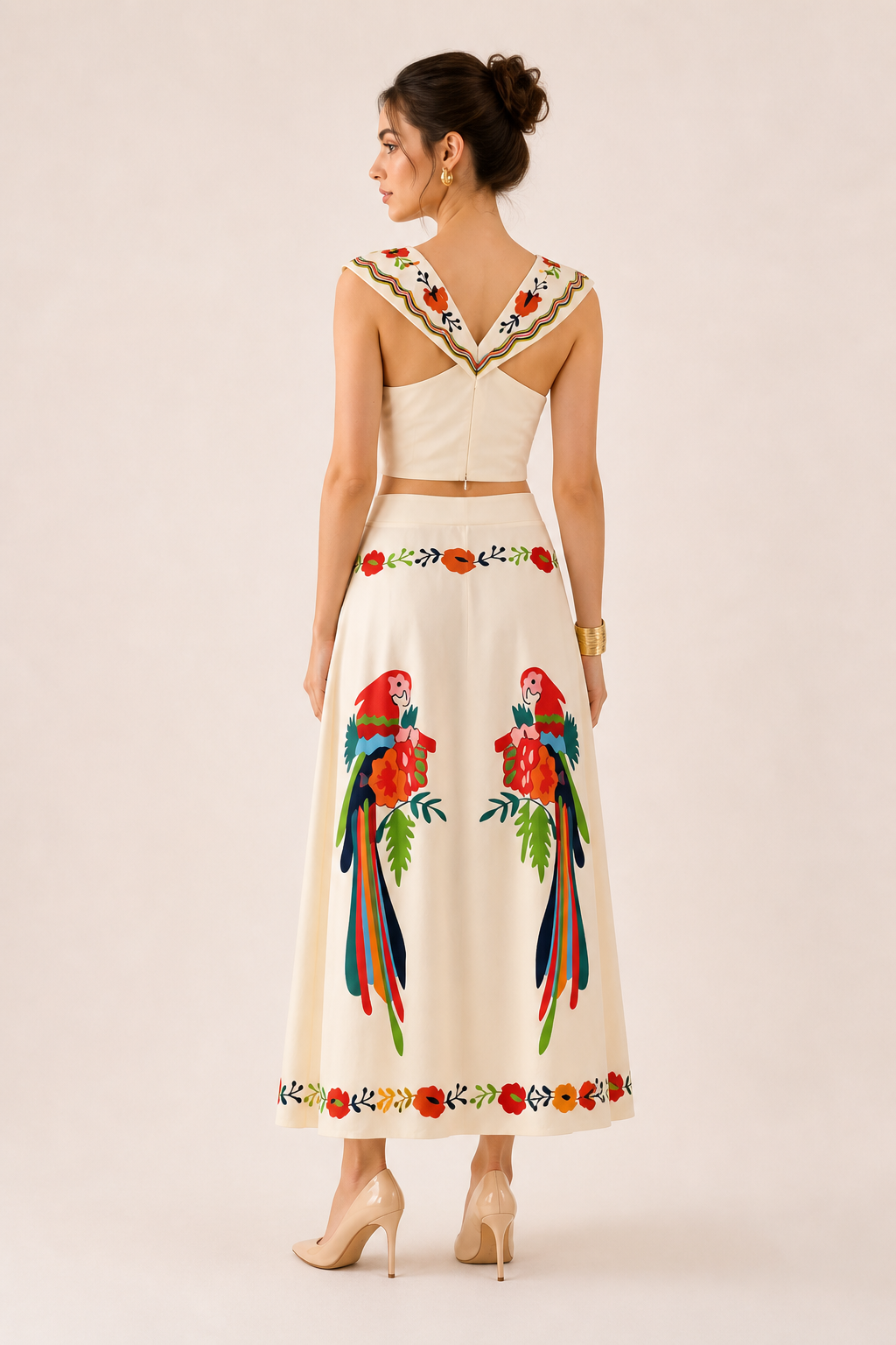 Stylish women's summer outfit: tropical print crop top and flowy maxi skirt set for travel and vacation.