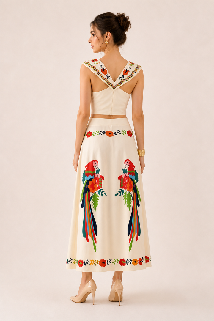 Stylish women's summer outfit: tropical print crop top and flowy maxi skirt set for travel and vacation.