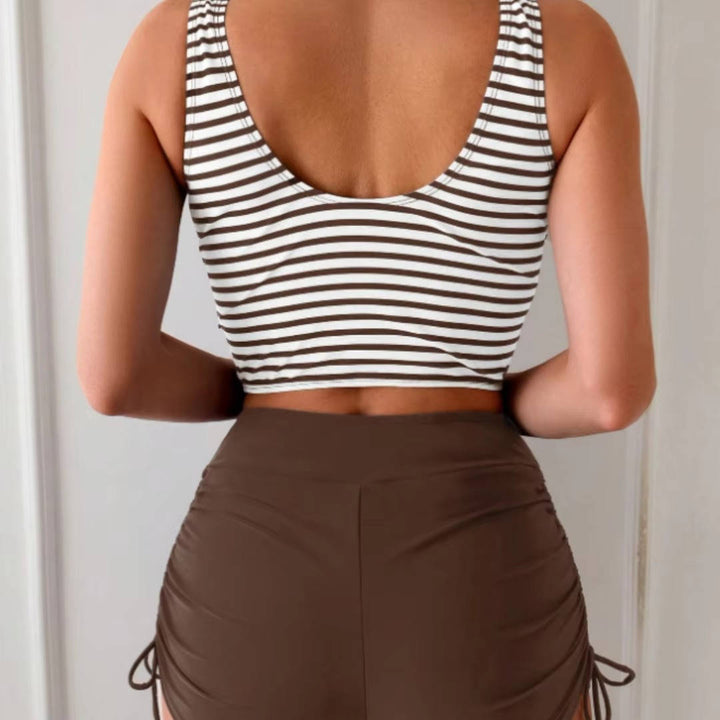 Adjustable twist front tankini top and high-waisted swimsuit bottom for women.