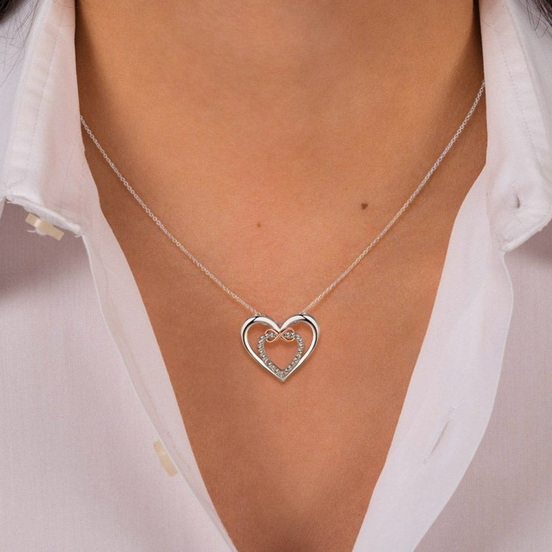 Women's silver infinity necklace with two heart pendants, ideal Mother's Day gift