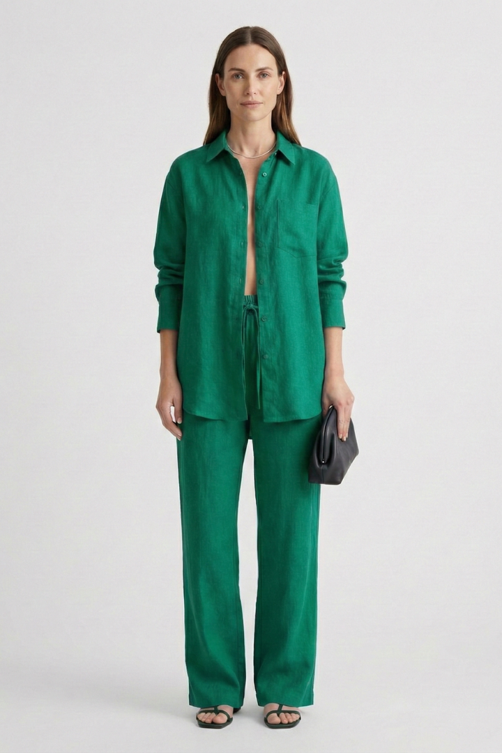 Women's elegant matching two-piece set: button shirt and straight trousers. Office or casual chic.