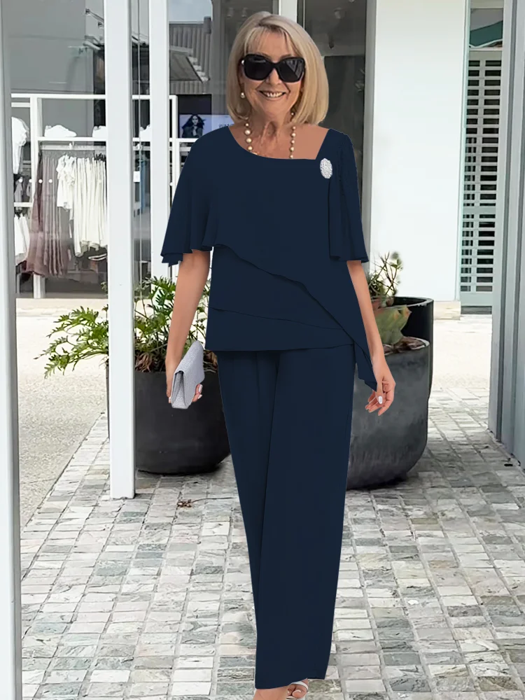Effortless women's two-piece set: short sleeve top & straight leg pants. Perfect matching ensemble for spring/summer casual wear.