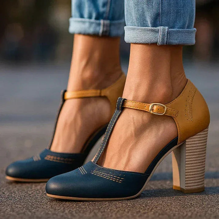 Stylish women's two-tone block heel pumps, featuring a classic design for versatile fashion footwear.