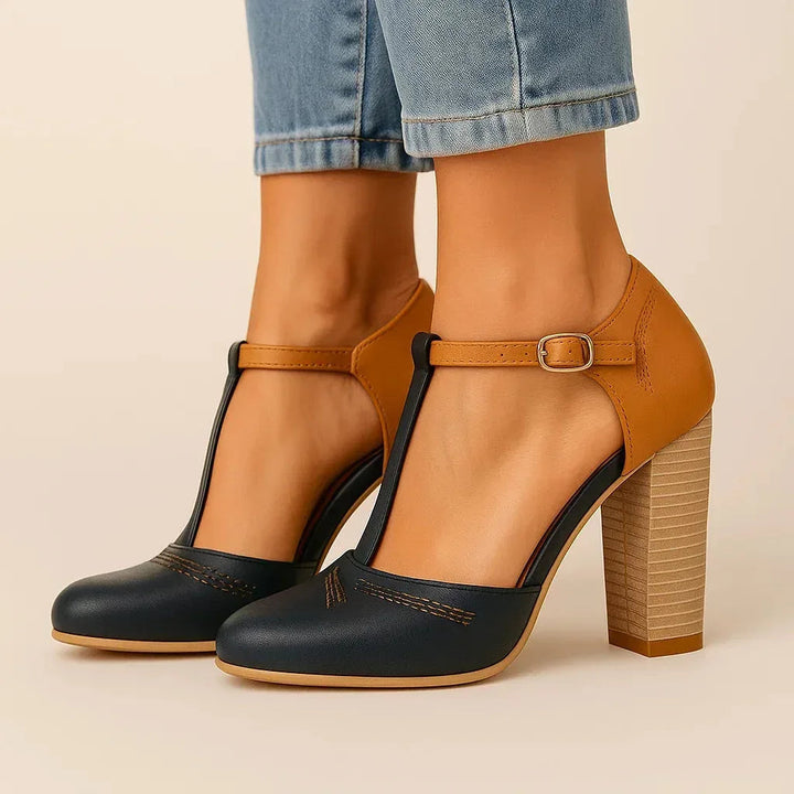 Chic ladies' two-tone block heel pumps, a comfortable and stylish footwear choice for everyday elegance.