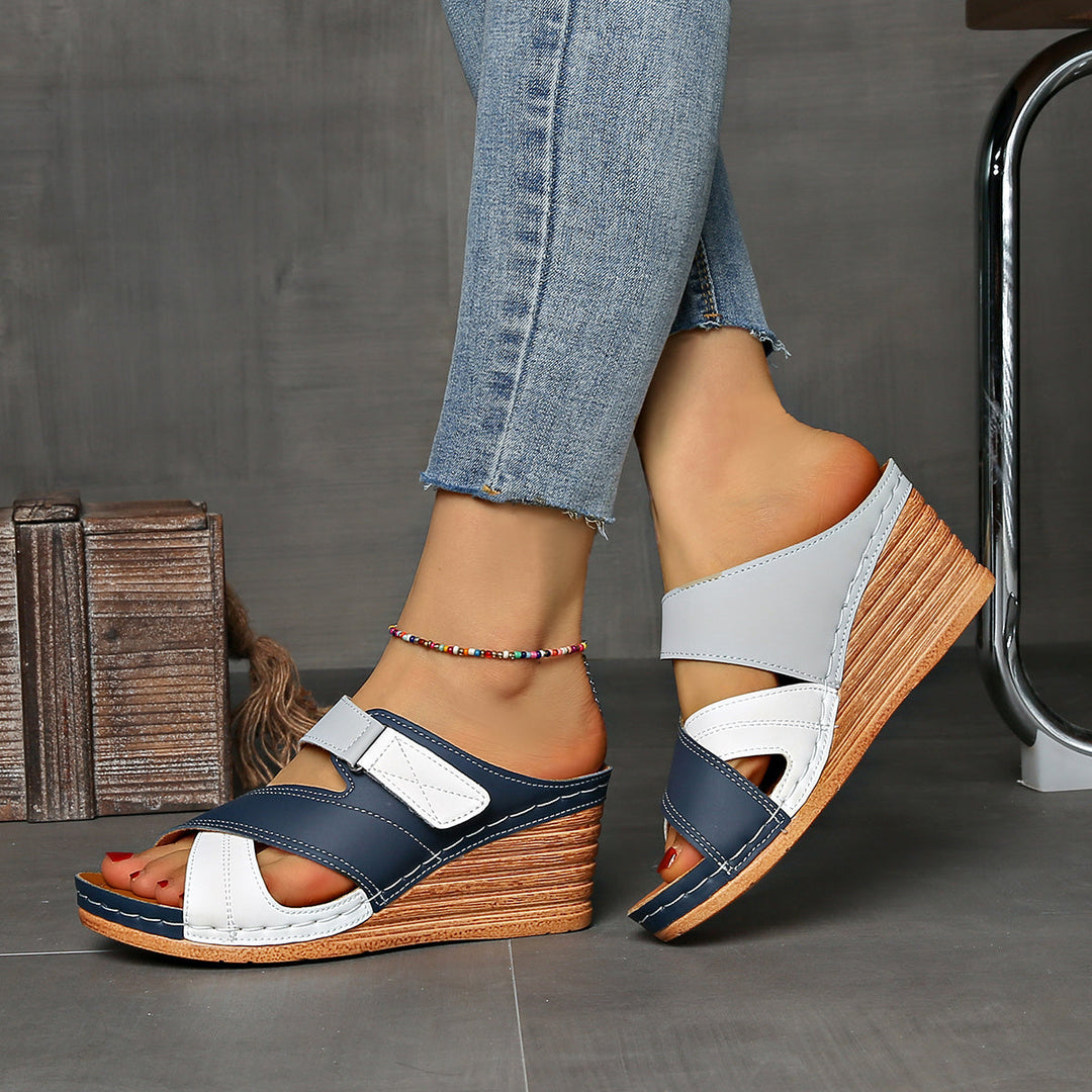 Versatile women's two-tone wedge sandals, offering stylish comfort as slip-on summer shoes for any casual event.