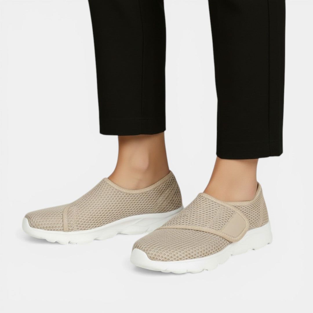 Breathable women's athletic slip-on sneakers, lightweight design for comfortable daily walking & support.