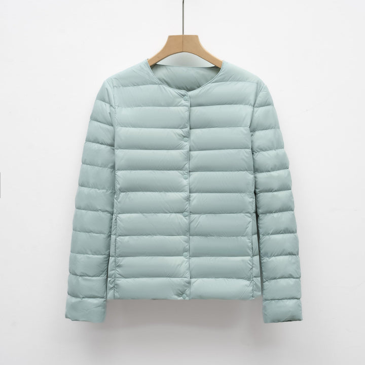 Women's ultralight collarless puffer jacket. A portable, warm outerwear piece for casual winter & spring style.