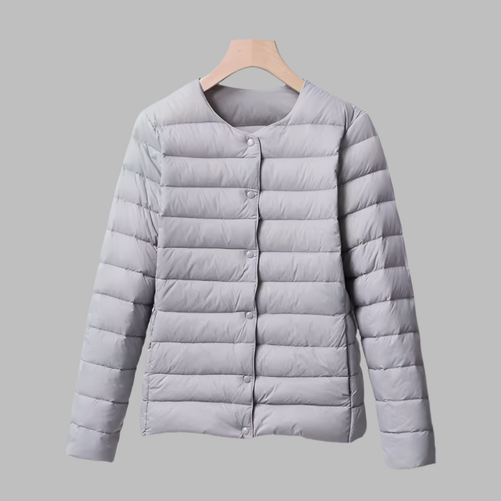 Versatile women's ultralight puffer jacket, collarless & packable. Essential outerwear for travel, spring & winter.