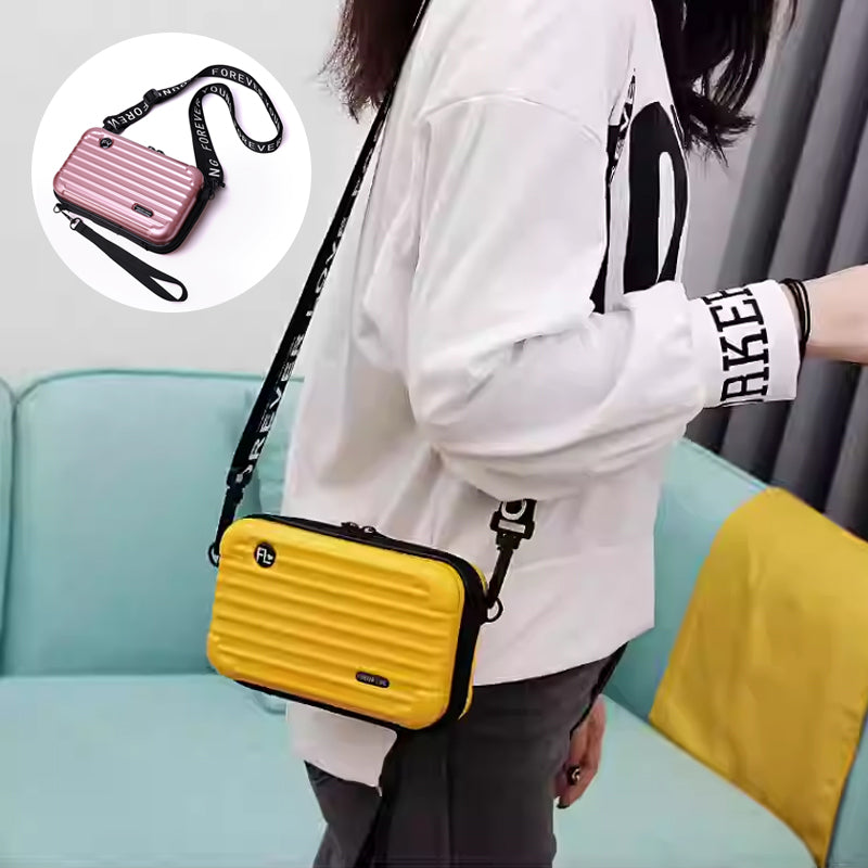 Trendy women's mini PVC suitcase crossbody bag, perfect as a travel bag