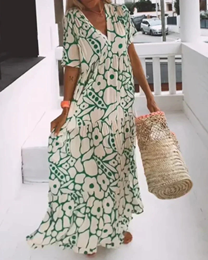 Vibrant abstract print maxi dress for women, a flowy and fashionable summer essential with a V-neck.