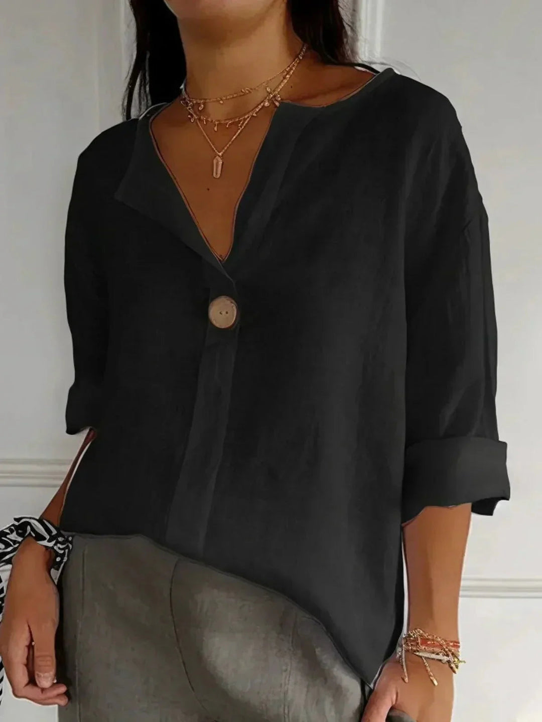 Stylish women's V-neck long sleeve blouse with adjustable roll tabs, a relaxed fit button-down for any season.