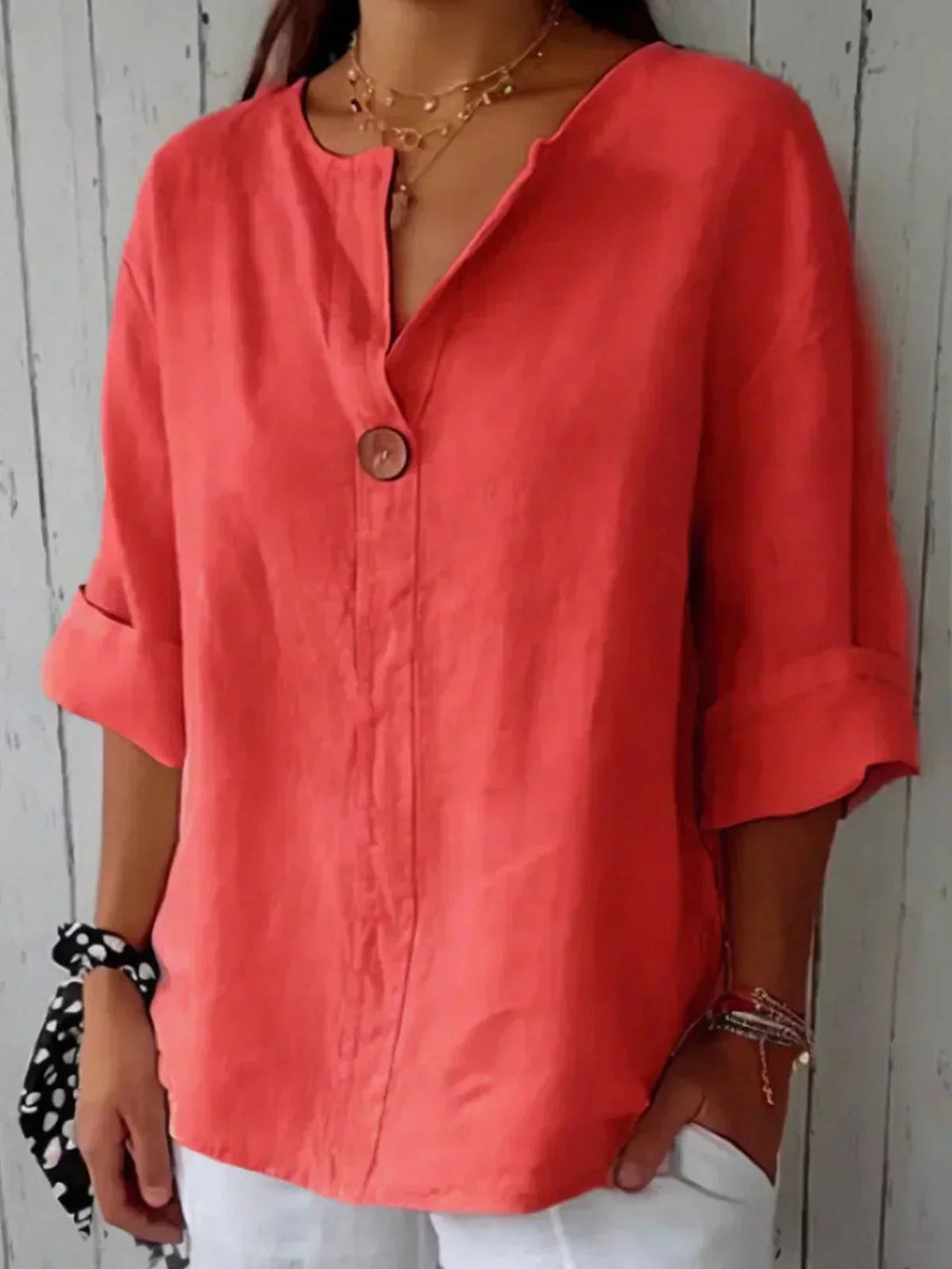 Relaxed fit women's V-neck blouse, button-down with adjustable roll tab sleeves. A comfortable casual top.