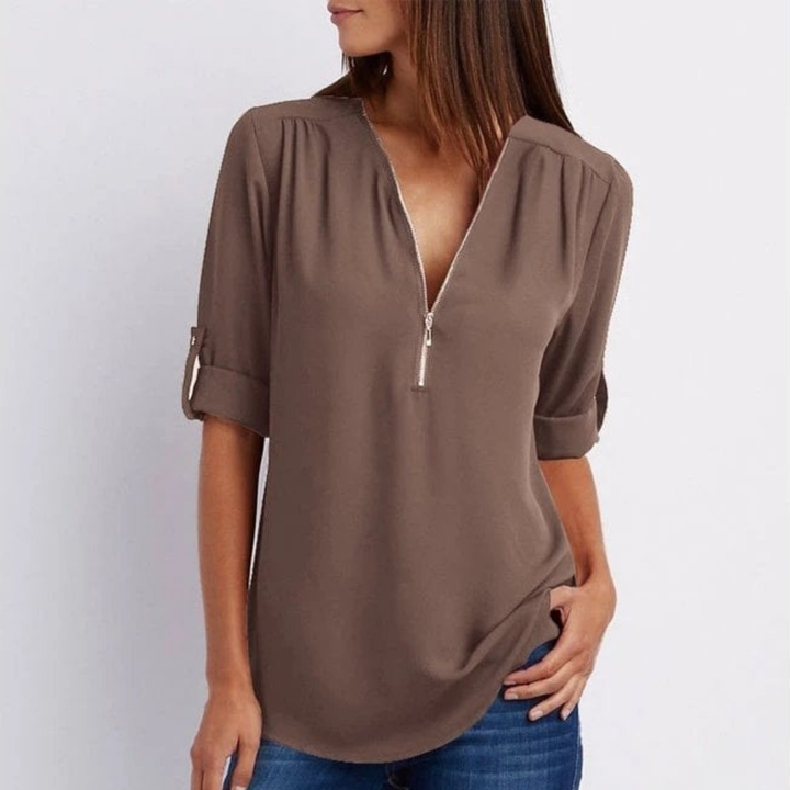 Effortless women's V-neck blouse featuring a zip front, relaxed fit, and roll-up sleeves for a chic look.